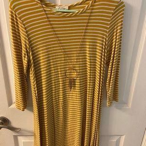 Yellow and white striped dress.